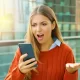 Woman Frustrated with Mobile Phone Shopping